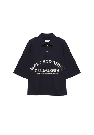 Polo noir oversize à manches courtes avec un texte blanc indiquant "West Paradise California The Place for Summer" sur le devant.