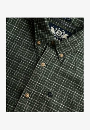 Green checkered shirt with white grid pattern, featuring a button-down collar, beige buttons, and embroidered logo on the chest pocket.