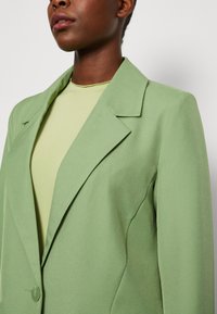 Only Shirt met V-hals ONLPETRA S/S LACE MIX TOP CS JRS in de online