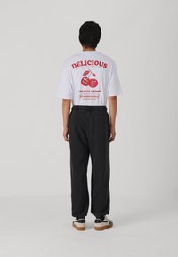 Abercrombie & Fitch TIMELESS GLOBAL TREND LOGO RELAXED - Träningsbyxor - black