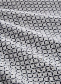 Gray fabric with a textured diamond pattern in dark blue, featuring soft, fuzzy material and a slight sheen.