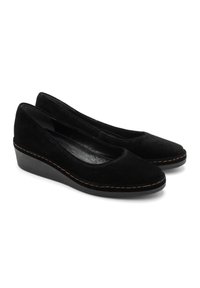 Scarpe con zeppa in suede nero, con punta arrotondata, design curvo e cuciture a contrasto lungo la suola. Interno liscio.