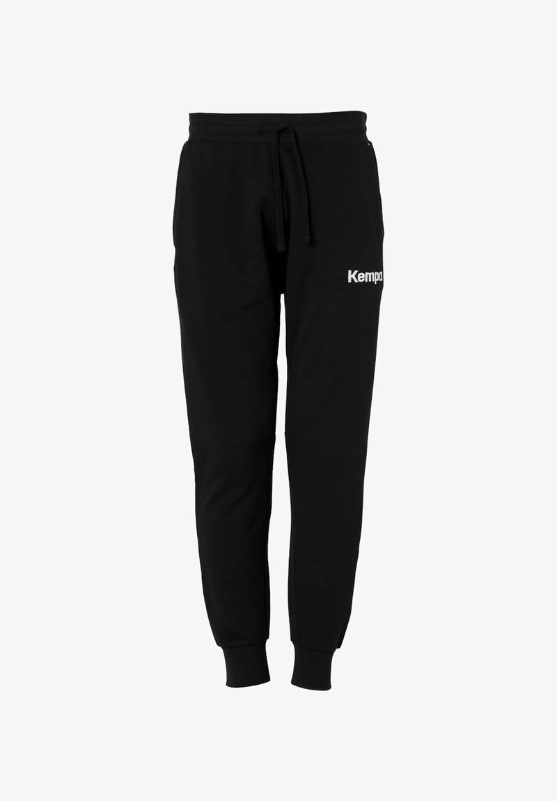 Pantalons de survêtement noirs en tissu doux, dotés d'une taille à cordon de serrage, de jambes fuselées et d'un logo "Kempa" blanc sur le côté gauche.