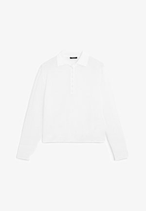 Polo-shirt blanc à manches longues avec un col, patte de boutonnage et poignets côtelés, fabriqué en tissu doux et léger.