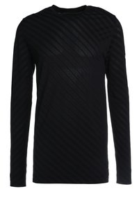 Musta pitkähihaine paita, jossa on vinoraitakuosi. Valmistettu tekstuurista kankaasta, jossa on pyöreä kaula-aukko ja slim fit -leikkaus.