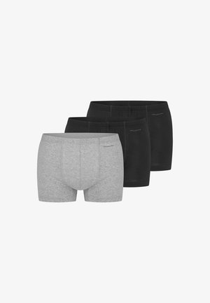 Tre bomulds herre boxershorts, to i sort og en i grå, arrangeret side om side med frontudsigt på hvid baggrund.