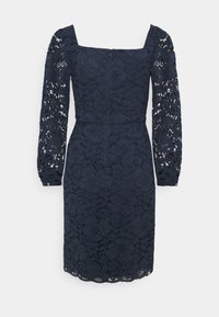 Navy dress featuring a square neckline, long lace sleeves, and a fitted silhouette. Lace texture with a scalloped hem detail.