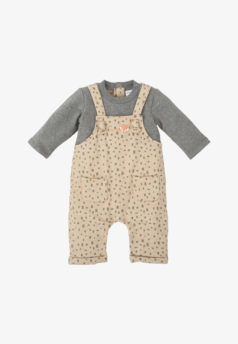 Peto beige con mangas largas grises, que presenta un patrón cuadrado repetido, dos bolsillos frontales y un gráfico de un zorro en el pecho.