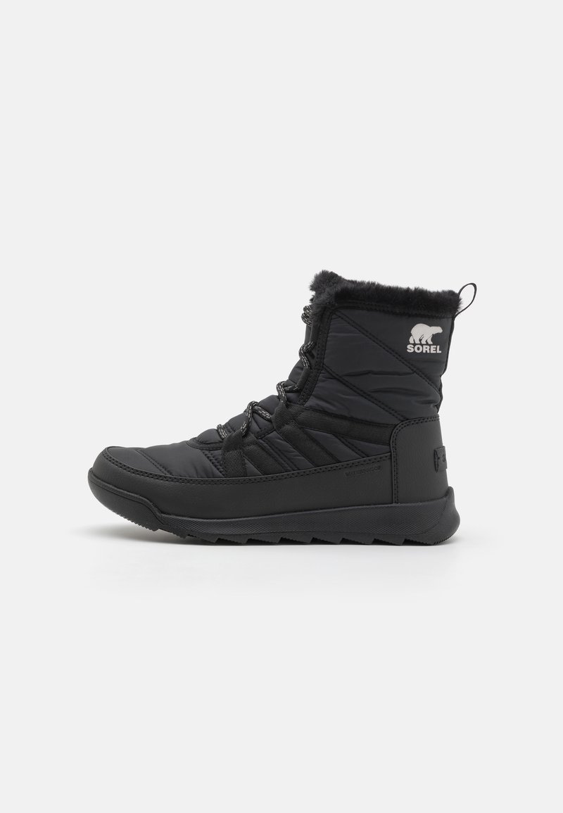 Black insulated winter boots with quilted nylon upper, faux fur collar, and rubber outsole for traction. Features Sorel logo on side.