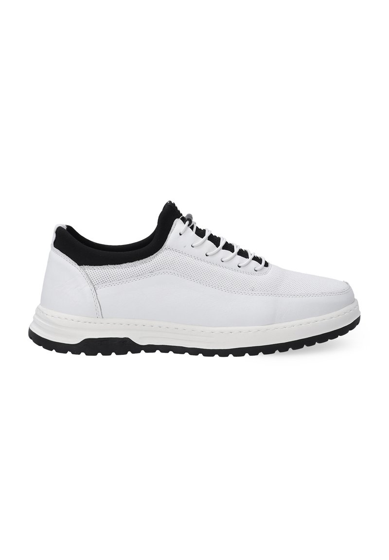 White sneakers with a black collar, featuring a smooth leather upper and mesh accents, a thick black rubber sole, and traditional lacing.
