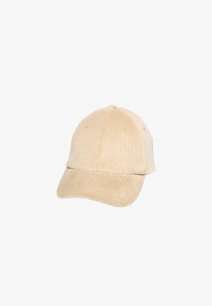 Beige corduroy cap with a curved brim, textured fabric, six-panel design, and ventilation grommets on the sides.