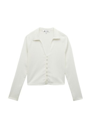 Valkoinen pitkähihaiset napillinen paita, jossa on kauluspäänti, valmistettu teksturoidusta kankaasta. Ominaisuuksiin kuuluu v-pääntie ja seitsemän nappia edessä.