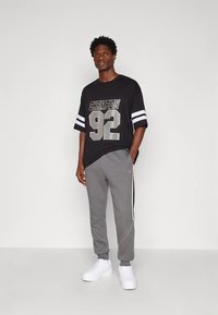 Champion URBAN SPORT CUFF PANTS - Calças de fato de treino - dark grey