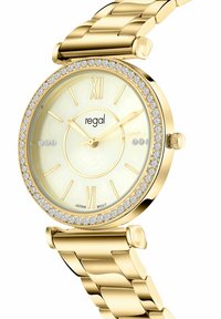 Gold-tone watch with a round face, cream dial, gold hour markers, and embellished bezel with crystals. Metal bracelet with a polished finish.