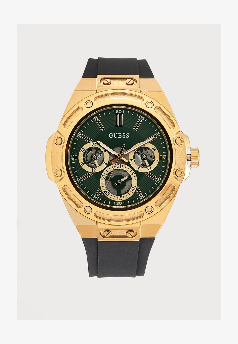 Златист часовник Guess с зелен циферблат, черна силиконова каишка, три подциферблата и златисти стрелки и индикатори.