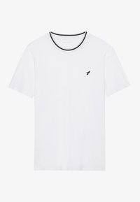 Weißes Baumwoll-T-Shirt mit kurzen Ärmeln, Rundhals und schwarzem Saum sowie einem kleinen schwarzen Vogel-Logo auf der linken Brustseite.
