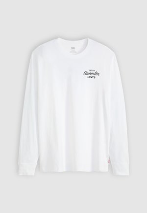 Valkoinen pitkähihaisen pyöreäkauluksinen paita, jossa ylävasempaan rintaan on painettu mustalla teksti "Denim Gremlin Levi's".