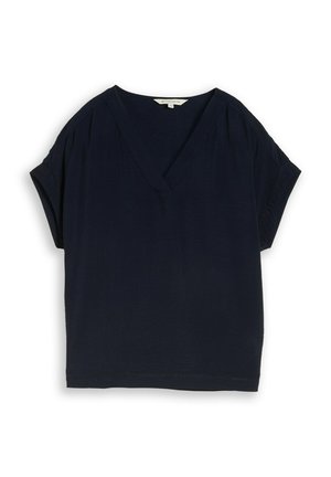 Blouse bleu marine à manches courtes avec col en V et coupe décontractée, avec des détails de couture subtils sur les manches et l'ourlet.