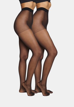 Schwarze, transparente Strumpfhosen mit einer glatten Oberfläche, die über einen breiten Bund und eine semi-matte Struktur verfügen und die Beine vom Oberschenkel bis zum Fuß zeigen.