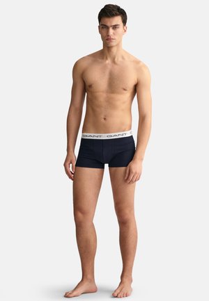 Navyblaue Boxershorts aus weichem Stoff, mit einem breiten elastischen Bund und bedrucktem Markennamen. Enganliegendes Design, bis zur Mitte des Oberschenkels.