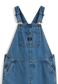 Peto vaquero con tirantes azules ajustables. Cuenta con un bolsillo delantero, botones laterales y una parche con el logo de Vans. Color azul claro, diseño clásico.