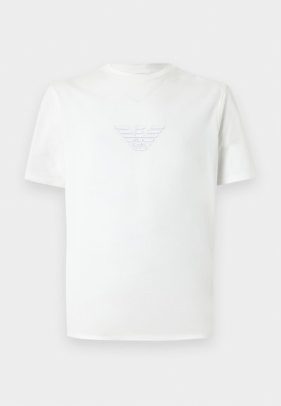 Λευκό κοντομάνικο t-shirt με στρογγυλή λαιμόκοψη και ανάγλυφο λογότυπο αετού Giorgio Armani στο κέντρο του στήθους.