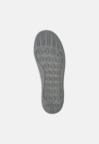 Gray rubber shoe sole with a dotted pattern for traction, featuring grooves and a textured finish. Marked with size 42.