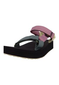 Des chaussures avec une semelle texturée noire, des sangles ajustables vertes et roses, et un design rembourré. Convient pour un usage décontracté.