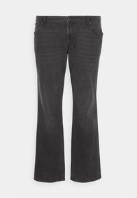 Jean flare en denim noir avec cinq poches, fermeture éclair, et bouton, présentant un léger délavage et un détail de couture classique.