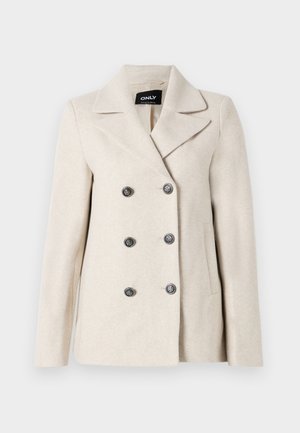 Beige double-breasted coat made of a soft, textured fabric featuring a notched lapel and six decorative black buttons, with two side pockets.