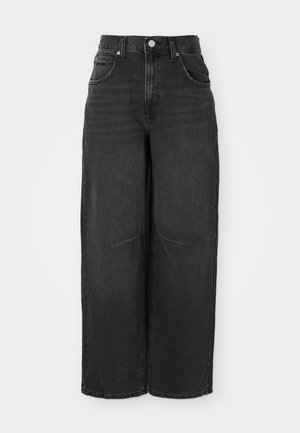 Čierne široké nohavice z denimu. Vysoký pás s uzáverom na gombík a pútkami na opasok. Obsahuje predné vrecká a viditeľné švy.