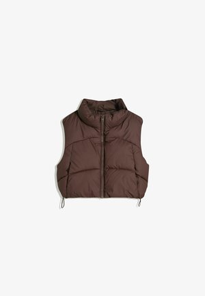 Brown puffer vest with high collar, full front zipper, and side drawstrings. Features quilted pattern for insulation. No sleeves.