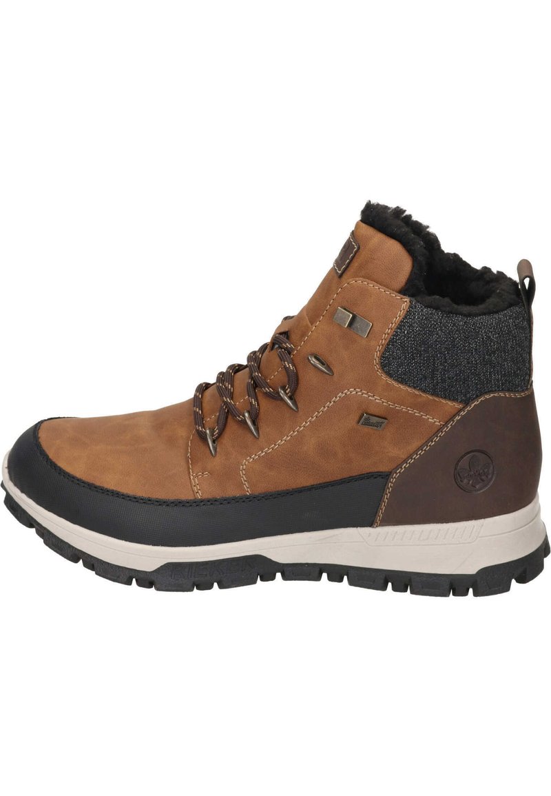Stivaletto in pelle marrone con suola in gomma nera. Presenta una fodera in pelliccia sintetica, occhielli in metallo e un accento in tessuto scuro sul retro.