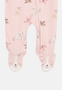Pink baby romper with animal prints, featuring footed sleeves with dog face accents, soft fabric, and a zip closure for easy dressing.