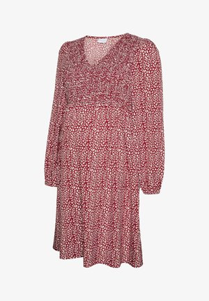 Rode jurk met een V-hals en lange mouwen, voorzien van een wit abstract patroon. De stof heeft een zachte textuur en een losse, vloeiende pasvorm.