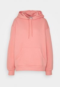 Přehnaně velká růžová mikina z měkké bavlněné směsi, s přední kapsou, kapucí na stažení šňůrkou a žebrovanými manžetami pro pohodlné nošení.