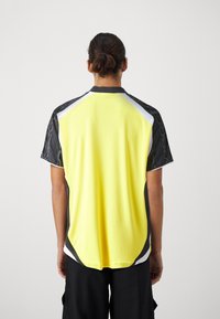 Puma Camiseta estampada - yellow