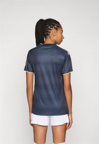 Dark blue athletic jersey with short sleeves, featuring a ribbed texture and light green accents at the collar and sleeve hems.