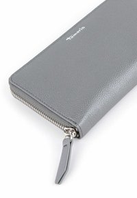 Gray leather wallet featuring a textured finish, zip closure, and a logo detail. Compact rectangular shape with silver hardware accents.