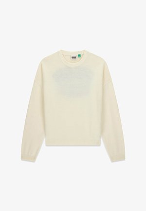 Roomkleurige trui van zacht gebreide stof, met een ronde hals, verlaagde schouders en een geribde zoom en manchetten.