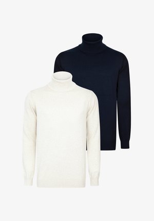 Dwa swetry z golfem: jeden w jasnym beżu, drugi w ciemnym granacie. Żebrowane dekolty i mankiety, dzianinowa faktura, oba mają długie rękawy.