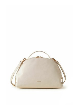 Cream leather handbag with curved top, gold-tone zipper accents, a top handle, and an adjustable shoulder strap.
