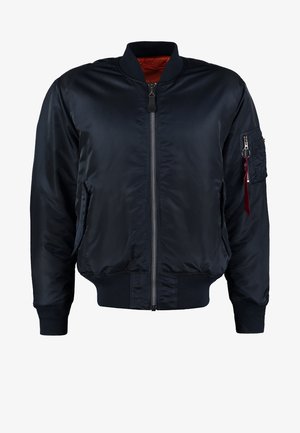 Marine bomberjack met een rits aan de voorkant, ribgebreide manchetten en zoom, zijzakken en een utility pocket op de mouw met een rode ritstrekkertje.