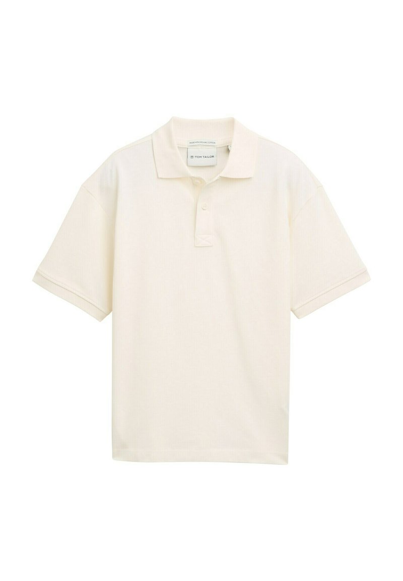 Korte mouwen polo shirt in licht crèmekleurig, gemaakt van katoen. Beschikt over een klassieke kraag en een knoopsluiting met drie knopen. Soepele textuur, relaxte pasvorm.