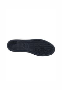 Schuhsohle mit einem strukturierten, Zick-Zack-Muster. Vorwiegend schwarzer Gummi mit einer markanten Logoform in der Mitte. Robuste Konstruktion.