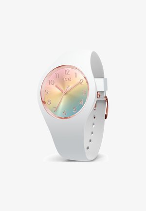 Montre en silicone blanche avec un cadran rond accentué de rose doré, arborant un fond dégradé bleu et rose, des chiffres clairs et de petites aiguilles.