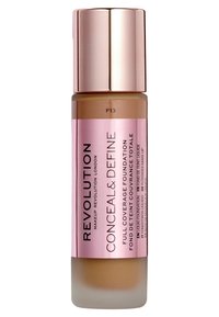 Le fond de teint liquide dans un flacon en verre présente une base givrée et un bouchon métallique rose brillant. L'étiquette comporte "Conceal & Define" et la teinte F13.