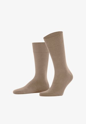 Paar beige mid-calf Kniestrümpfe, glatte Textur mit leicht geripptem Bündchen, auf weißem Hintergrund dargestellt.