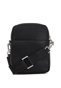 Black leather crossbody bag with a textured finish, featuring silver hardware and an adjustable strap with patterned branding.