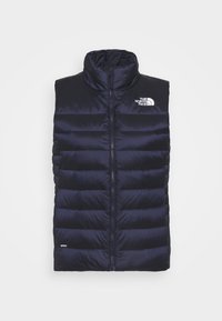 Dunkelblauer Puffer-Weste mit hohem Kragen, Frontreißverschluss und weißem Logo. Verfügt über eine horizontale Steppoptik und isolierende Polsterung.